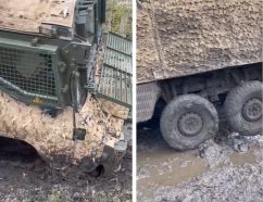Un Vector PPV con una rueda delantera rota en una carretera de barro, primavera de 2023.